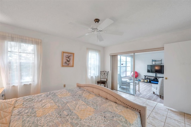 bedroom with light tile patterned flooring and ceiling fan