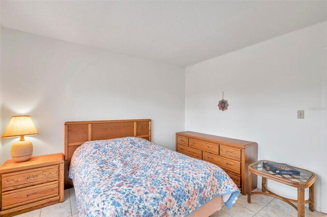 3840 Staysail Ln Unit 3840, Holiday, FL 34691 - bedroom featuring light tile patterned floors