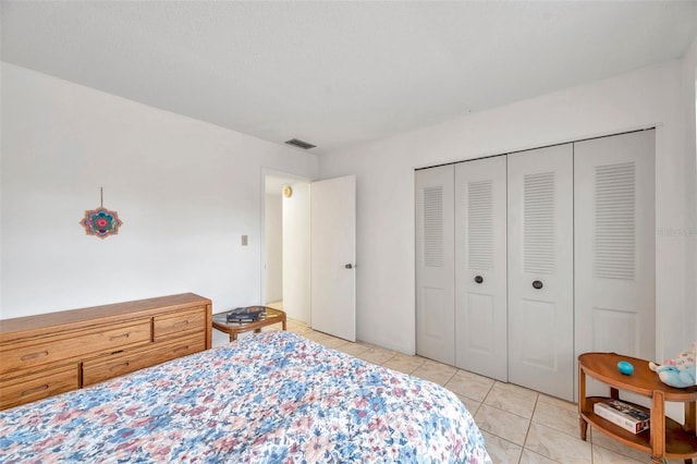 3840 Staysail Ln Unit 3840, Holiday, FL 34691 - bedroom with light tile patterned floors and a closet