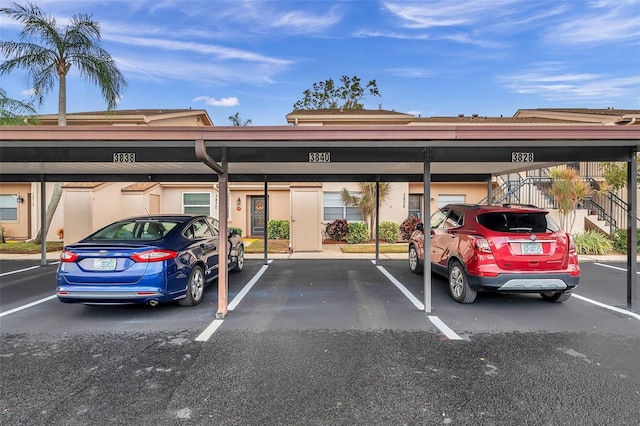 view of parking / parking lot featuring a carport