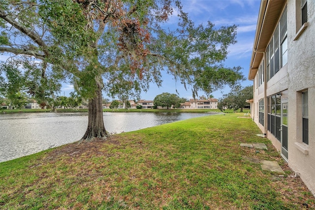 3840 Staysail Ln Unit 3840, Holiday, FL 34691 - view of grassy yard featuring a water view and a residential view