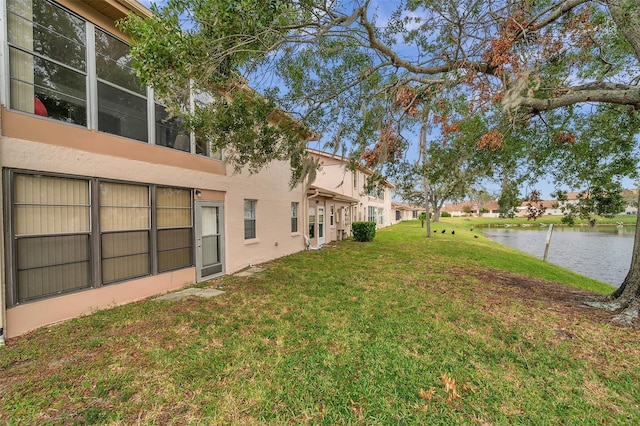 3840 Staysail Ln Unit 3840, Holiday, FL 34691 - view of green lawn featuring a water view