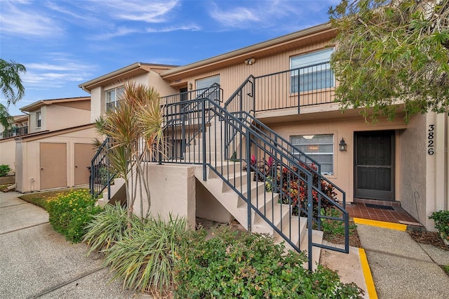 view of front of property with a storage unit