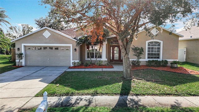 ranch-style home featuring a front yard and a garage