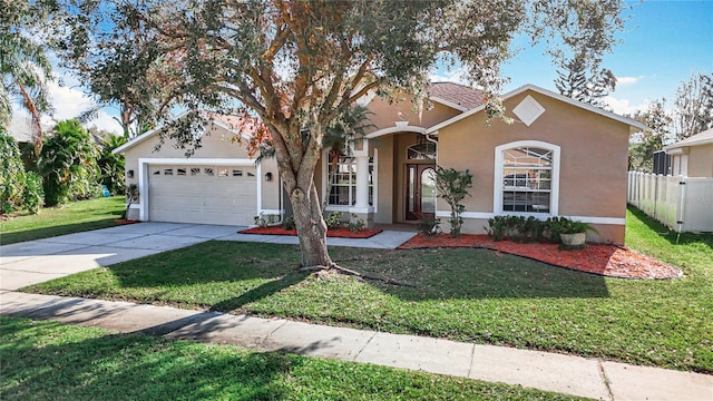 view of front of house featuring a garage and a front lawn