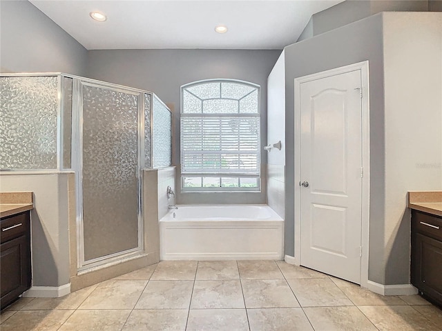 bathroom featuring vanity, tile patterned floors, and separate shower and tub