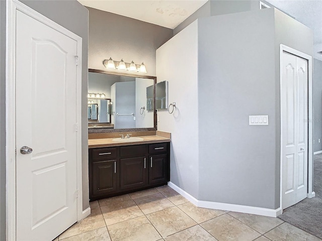 bathroom with vanity and tile patterned floors