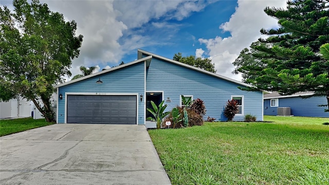 ranch-style house with a front lawn, central AC, and a garage