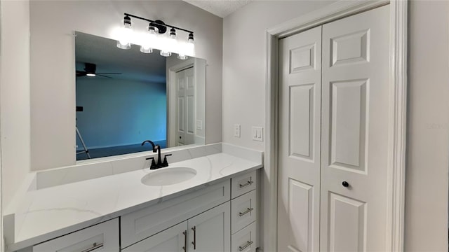 bathroom featuring vanity and ceiling fan