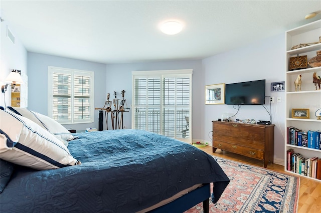 bedroom featuring wood-type flooring