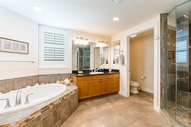 full bathroom with vanity, toilet, tile patterned floors, and shower with separate bathtub