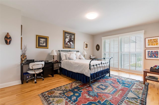 bedroom with light hardwood / wood-style floors