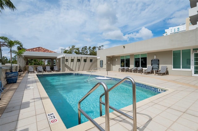 view of swimming pool featuring a gazebo and a patio area