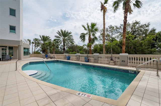 view of swimming pool with a patio area