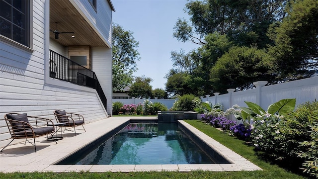 view of swimming pool with a patio and an in ground hot tub