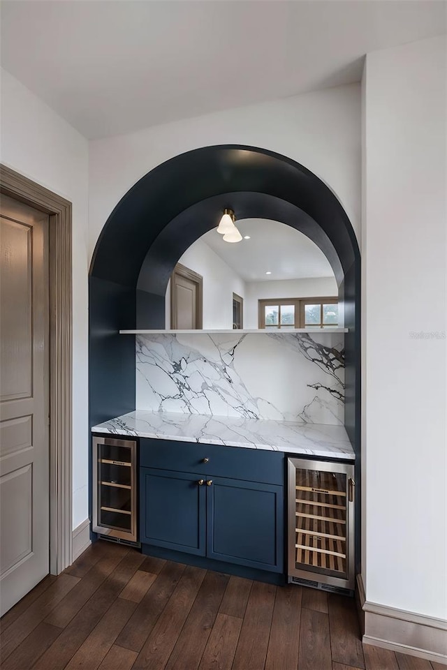 bar with wine cooler, decorative backsplash, and dark hardwood / wood-style floors