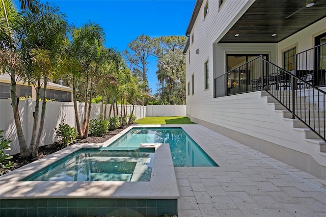 4633 W Lowell Ave, Tampa, FL 33629 - view of pool featuring stairway, a fenced backyard, a pool with connected hot tub, and a patio