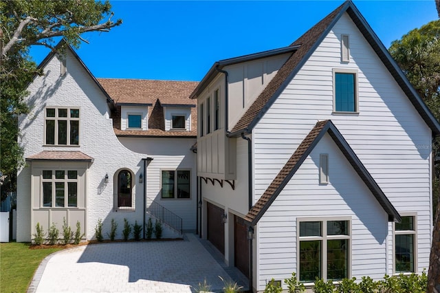 4633 W Lowell Ave, Tampa, FL 33629 - tudor-style house featuring board and batten siding, driveway, and roof with shingles