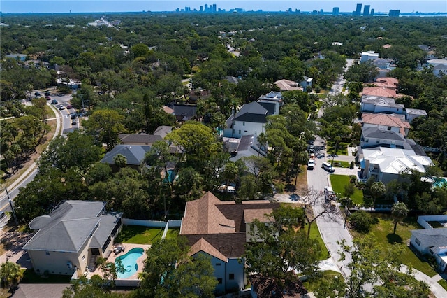 4633 W Lowell Ave, Tampa, FL 33629 - aerial view of property's location featuring a pool area, nearby suburban area, and city skyline
