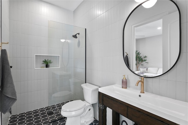 4633 W Lowell Ave, Tampa, FL 33629 - bathroom featuring tile walls, walk in shower, toilet, and vanity