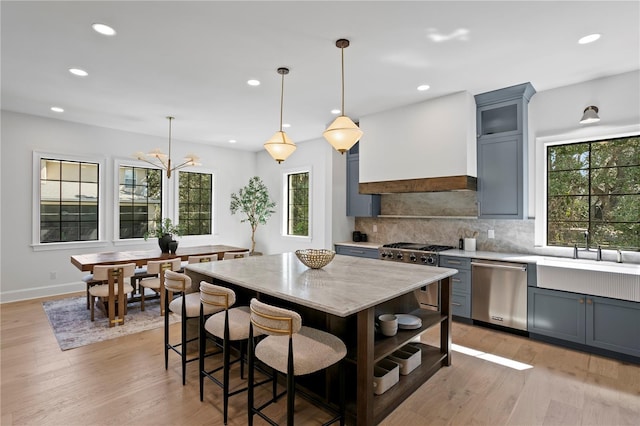 4633 W Lowell Ave, Tampa, FL 33629 - kitchen featuring appliances with stainless steel finishes, custom exhaust hood, backsplash, gray cabinets, and recessed lighting