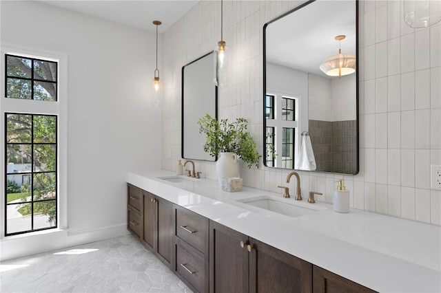 4633 W Lowell Ave, Tampa, FL 33629 - full bathroom with double vanity and tasteful backsplash