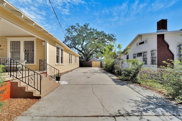 view of property exterior featuring fence