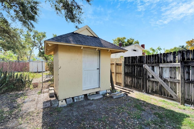 view of shed with a fenced backyard