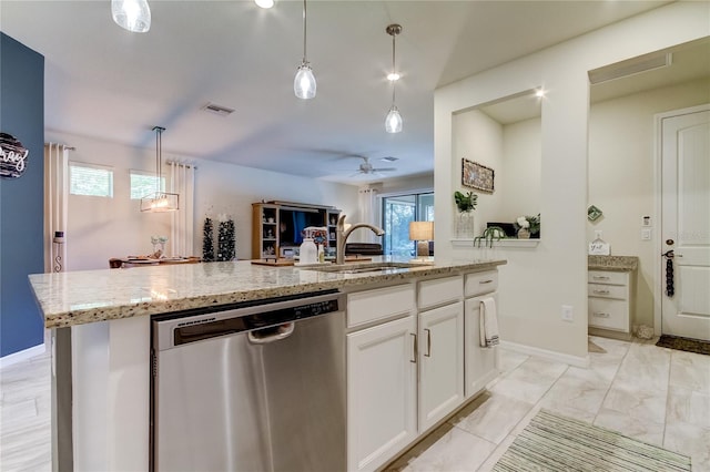 kitchen featuring an island with sink, white cabinetry, ceiling fan, pendant lighting, and stainless steel dishwasher