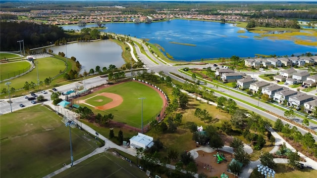 birds eye view of property with a water view