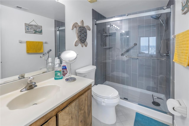 bathroom with walk in shower, toilet, vanity, and tile patterned floors