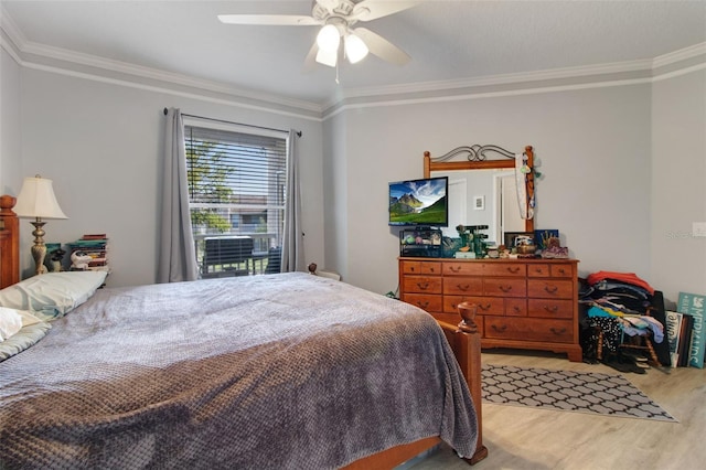 bedroom with ornamental molding and ceiling fan