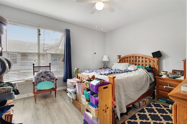 bedroom featuring light wood-type flooring and ceiling fan