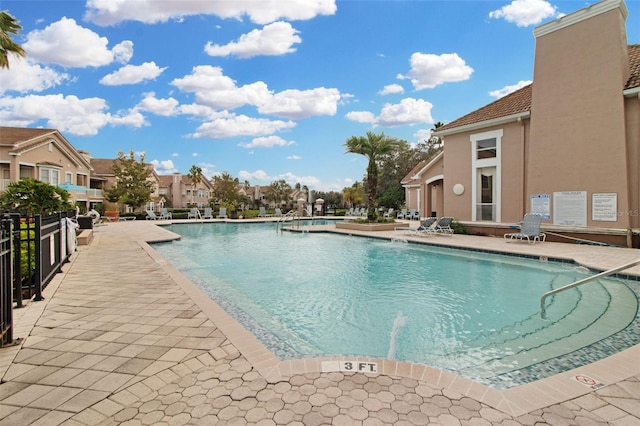 view of swimming pool with a patio