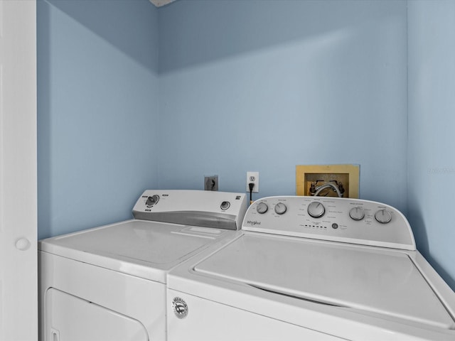 clothes washing area featuring washing machine and dryer