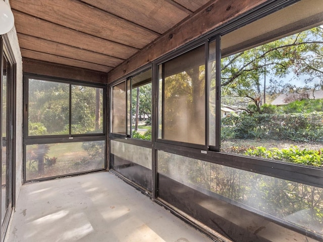 unfurnished sunroom featuring wooden ceiling