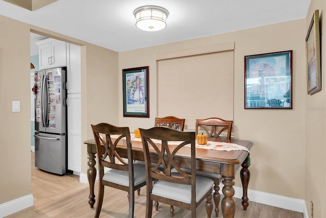 dining area with light wood-type flooring