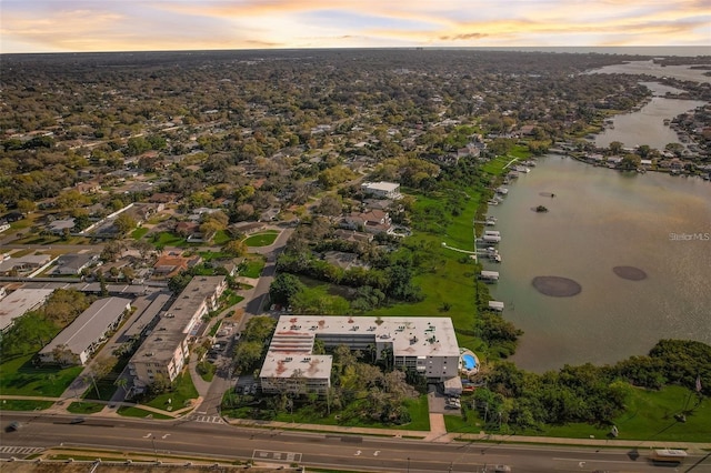 aerial view at dusk with a water view