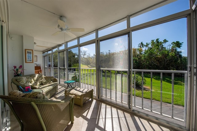 sunroom featuring a wealth of natural light and ceiling fan