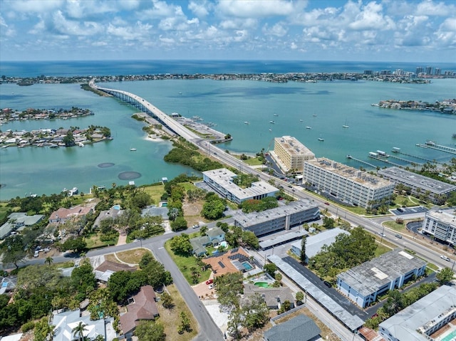 birds eye view of property featuring a water view and a city view