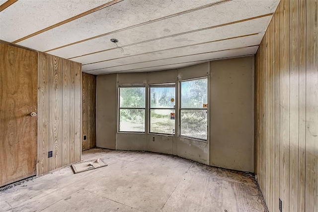 miscellaneous room featuring wooden walls