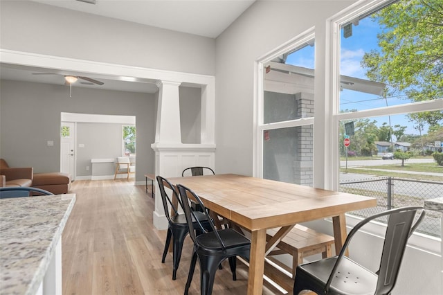 dining space featuring ceiling fan, light hardwood / wood-style floors, and a healthy amount of sunlight