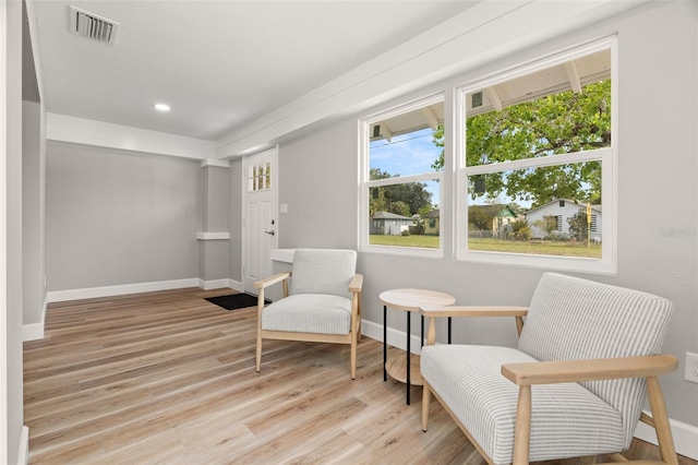 sitting room featuring light hardwood / wood-style floors