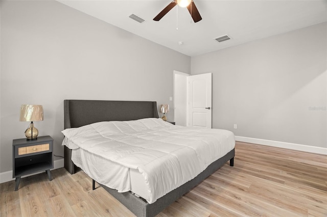 bedroom featuring light hardwood / wood-style floors and ceiling fan