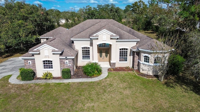 view of front facade featuring french doors and a front lawn