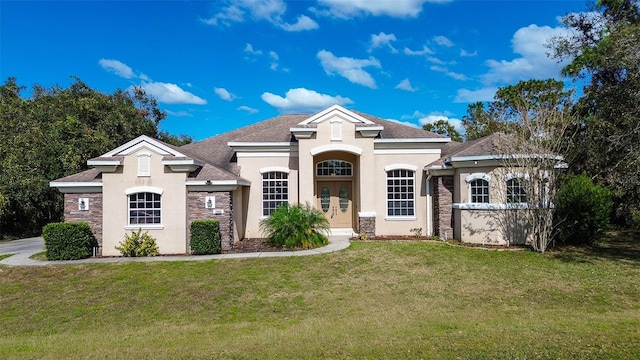 french country style house featuring a front lawn and french doors