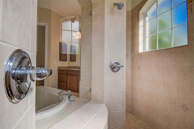 bathroom with independent shower and bath and vanity