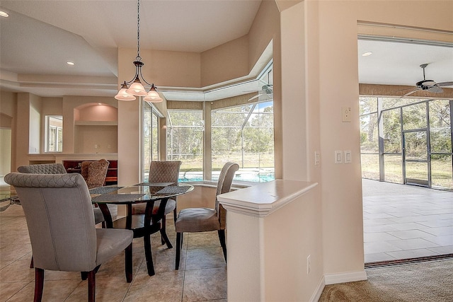 dining room with light tile patterned floors, ceiling fan, and built in features