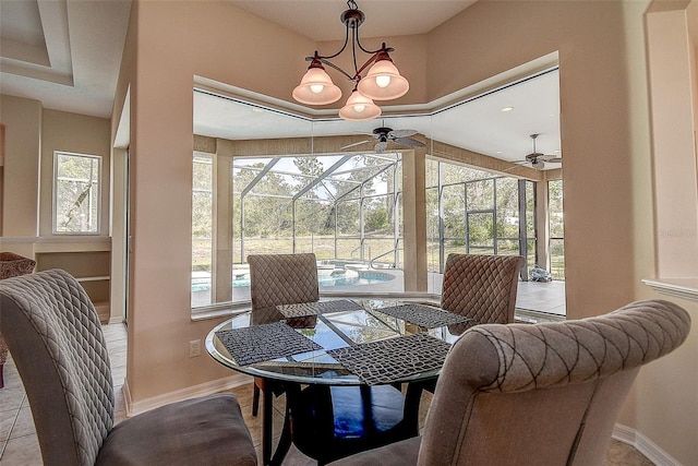 tiled dining area with ceiling fan