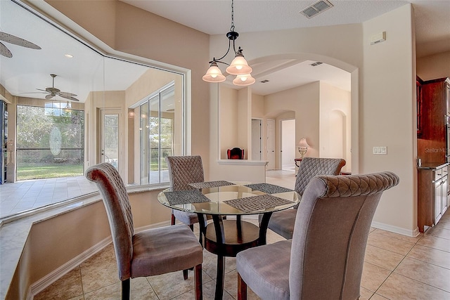 dining area featuring ceiling fan and light tile patterned flooring